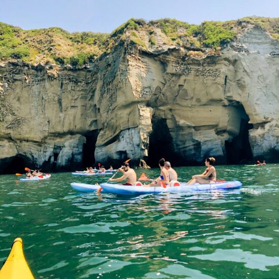 excursionist in kayak paddling in Baia trentaremi a Napoli