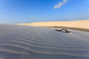 White sand dunes panorama from Lencois Maranhenses National Park, Brazil. Rainwater lagoon. Brazilian landscape